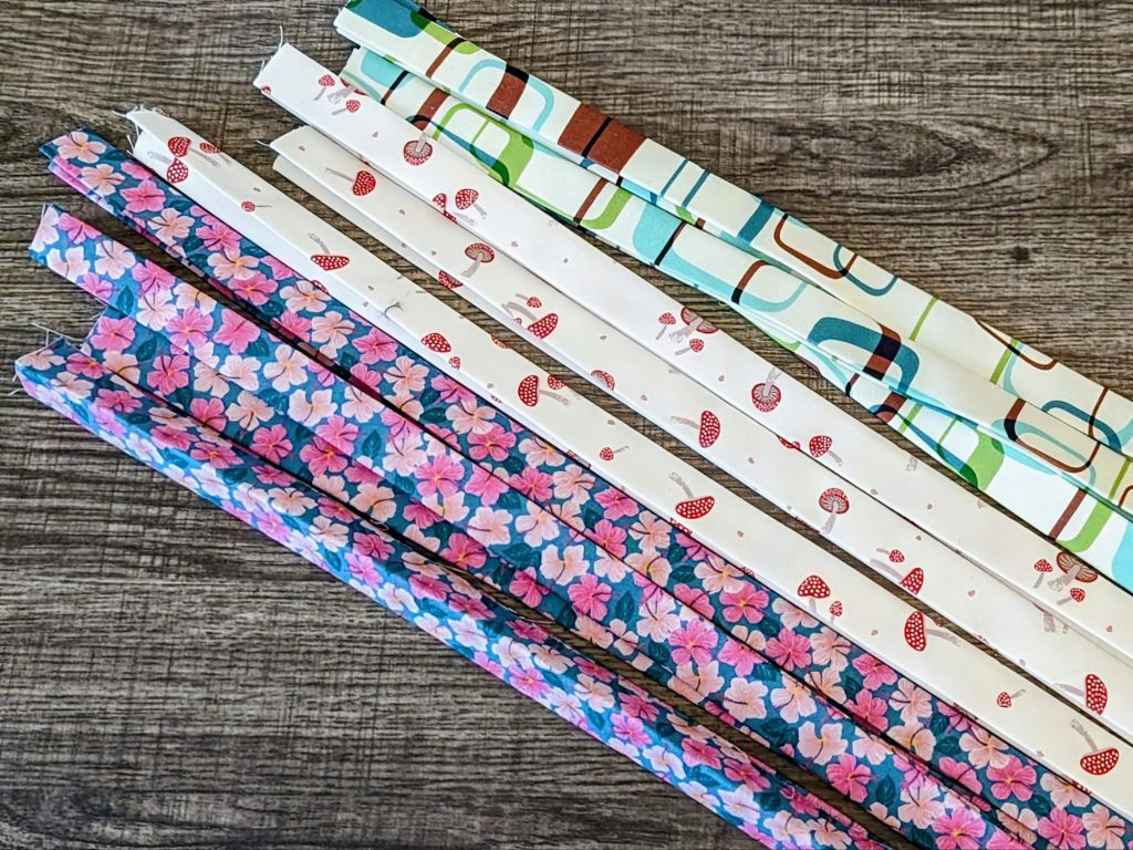 Bunch of fabrics strips ready to be made into key chain lanyards.
